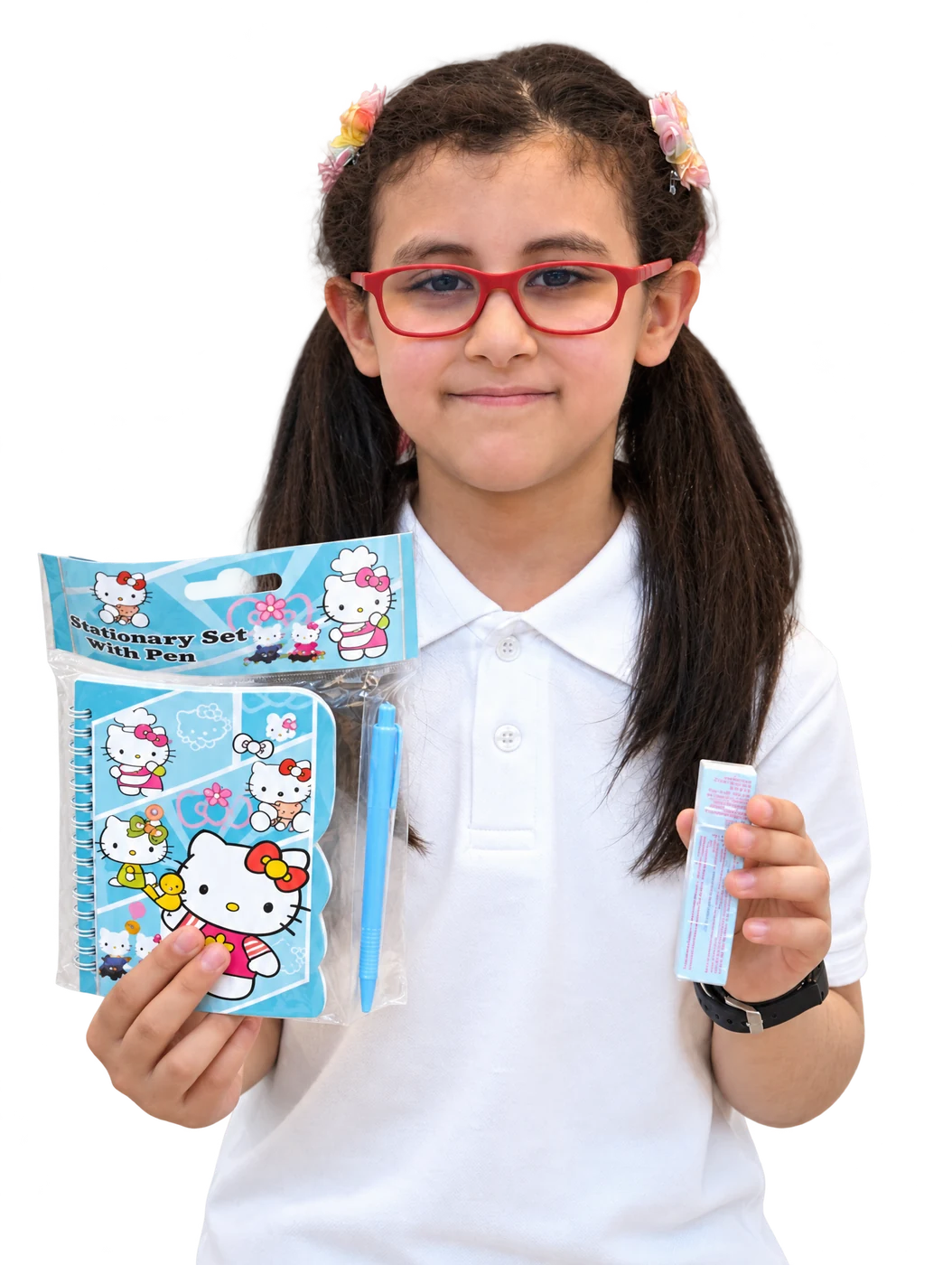 Pupil with red glasses proudly holding her stationery gift